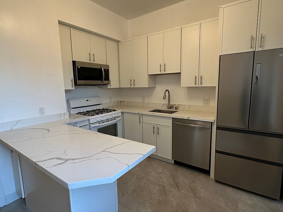 Newly renovated kitchen with all new appliances and cabinets; includes dishwasher, garbage disposal, and microwave
