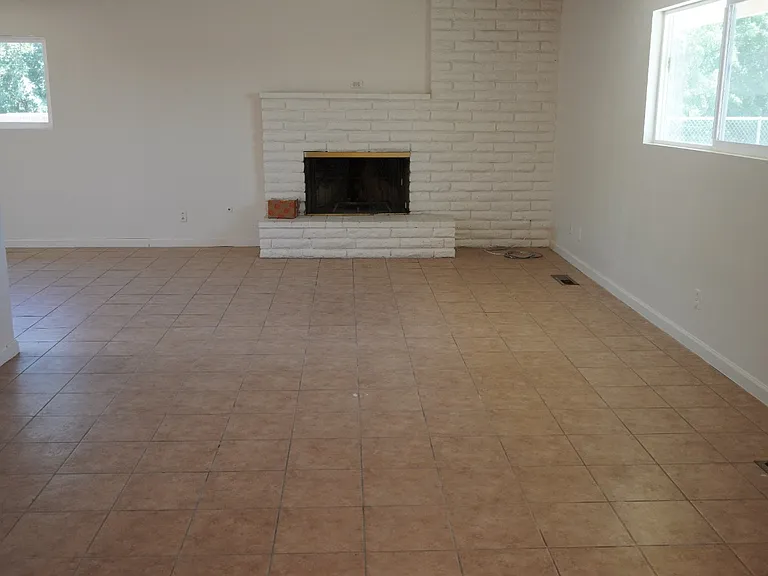 large living room with a fireplace
