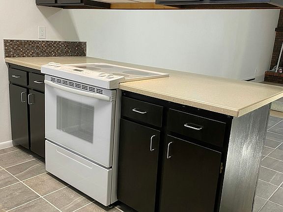 Kona Brown, dark stain cabinets