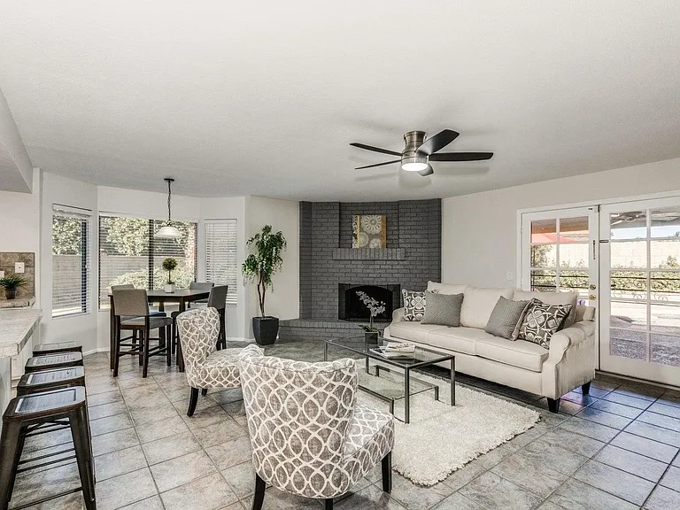 Family Room with fireplace, TV, plenty of comfortable seating for family and friends!