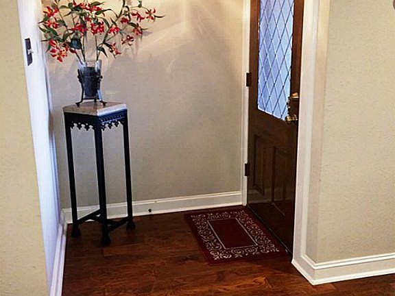 Welcoming lead glass front door!  Home features hard-wired alarm system with 3 motion sensors, and sensors on all windows, doors & glass
