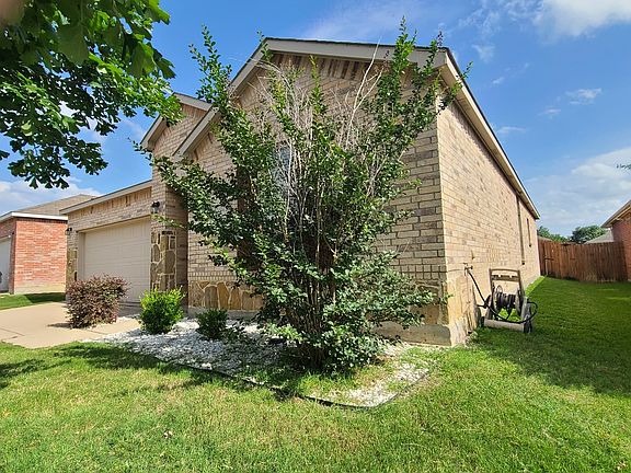 Right side of the house, leading to backyard gate