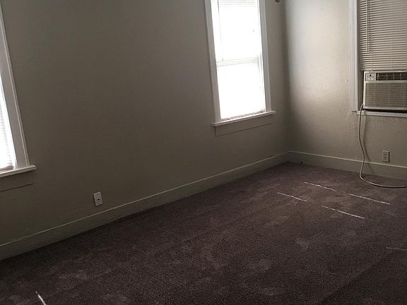 Bedroom with new dark gray carpet