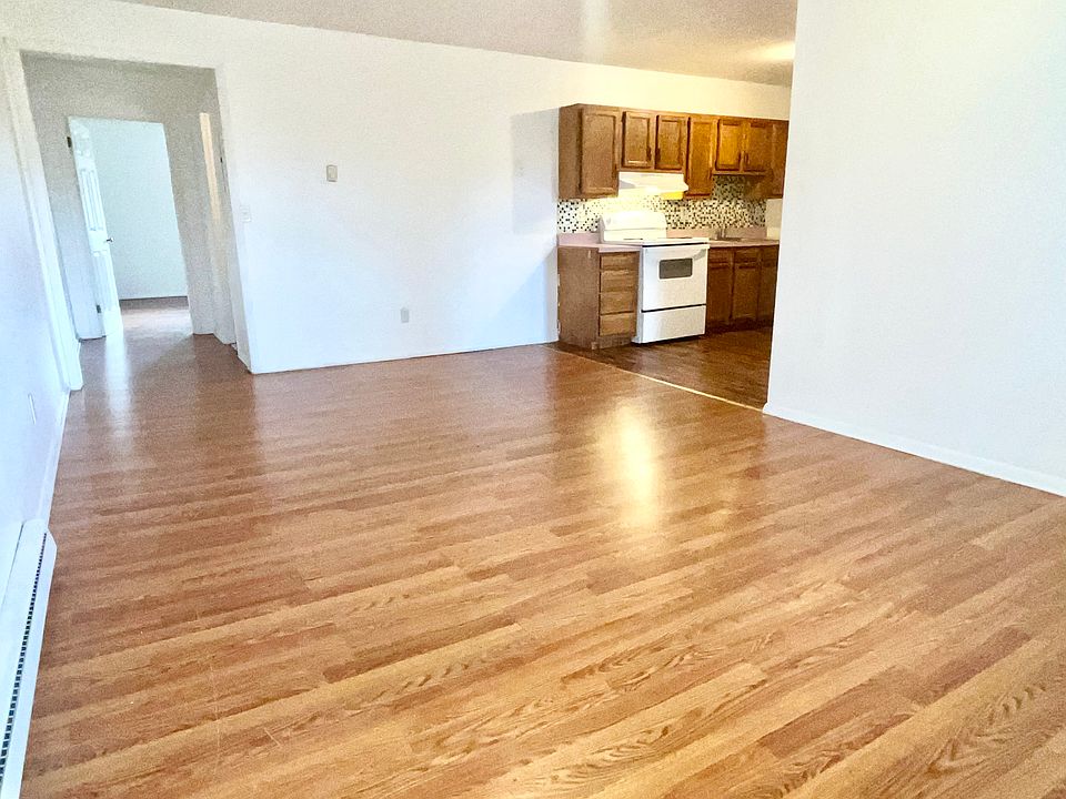 Open concept, enter into living room with space for dining table