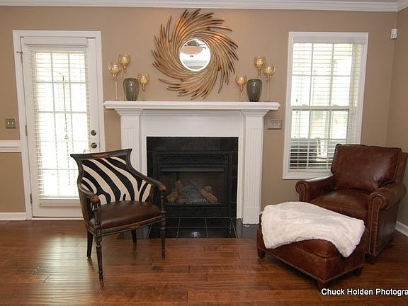 Fireplace with Gas Logs Trimmed in Elegant Black Slate Tile