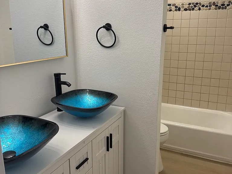Full bath upstairs with new luxury double vanity, tub/ shower and toilet