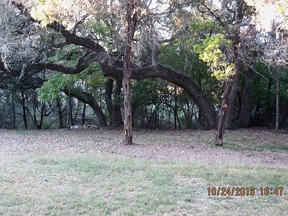 Lovely .78 acre lot with large oaks and seasonal creek at back.