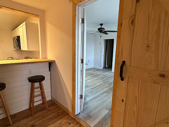 Bedroom off kitchen with large full bathroom.