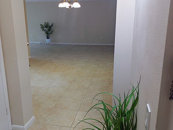 Spacious condo entry looking into dining area of the great room