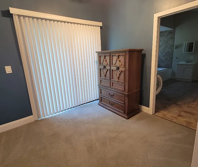 Master bedroom has slider to back yard
