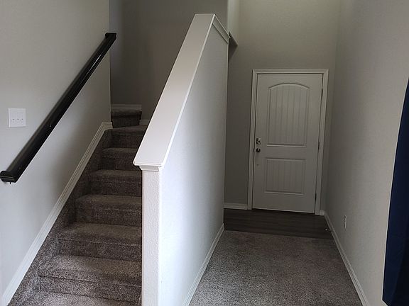 Front entry door and stairs to upper level