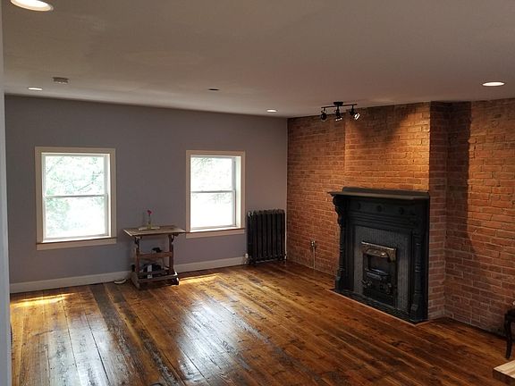 Spacious and bright, restored wide plank heart pine floors.