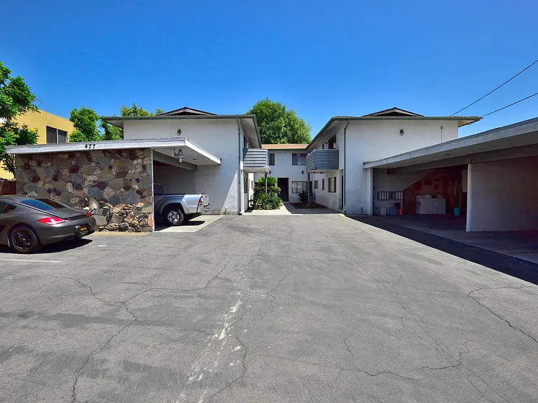 1 COVERED parking space in the right-side carport