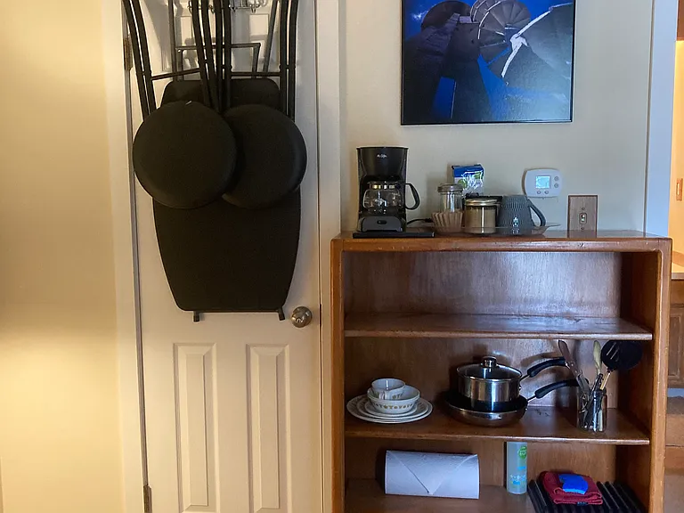 Bookcase with Basic Cookery. Coffee Maker, Electric Kettle, Electric Hot Plate.