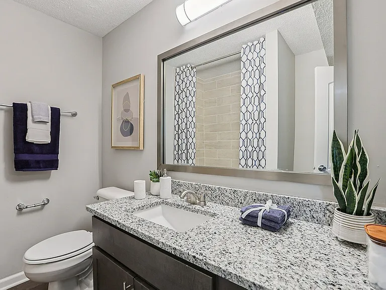 Bright bathroom with granite counters