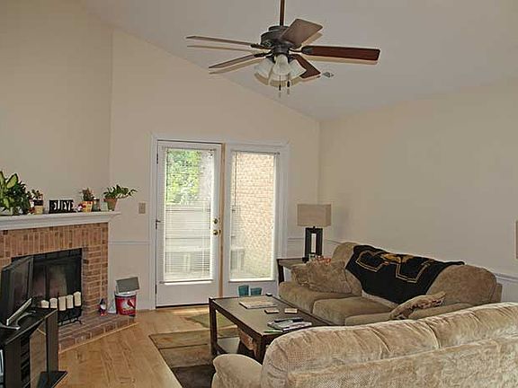 Living room w/vaulted ceiling. French doors to deck.