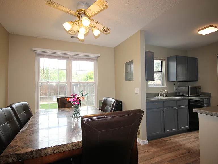 Dining Area with large picture window to back of home
