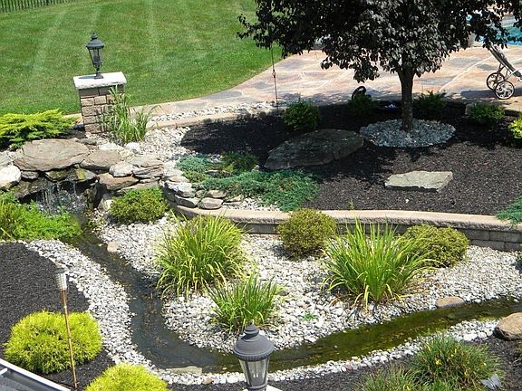 Streams and landscaping throughout backyard