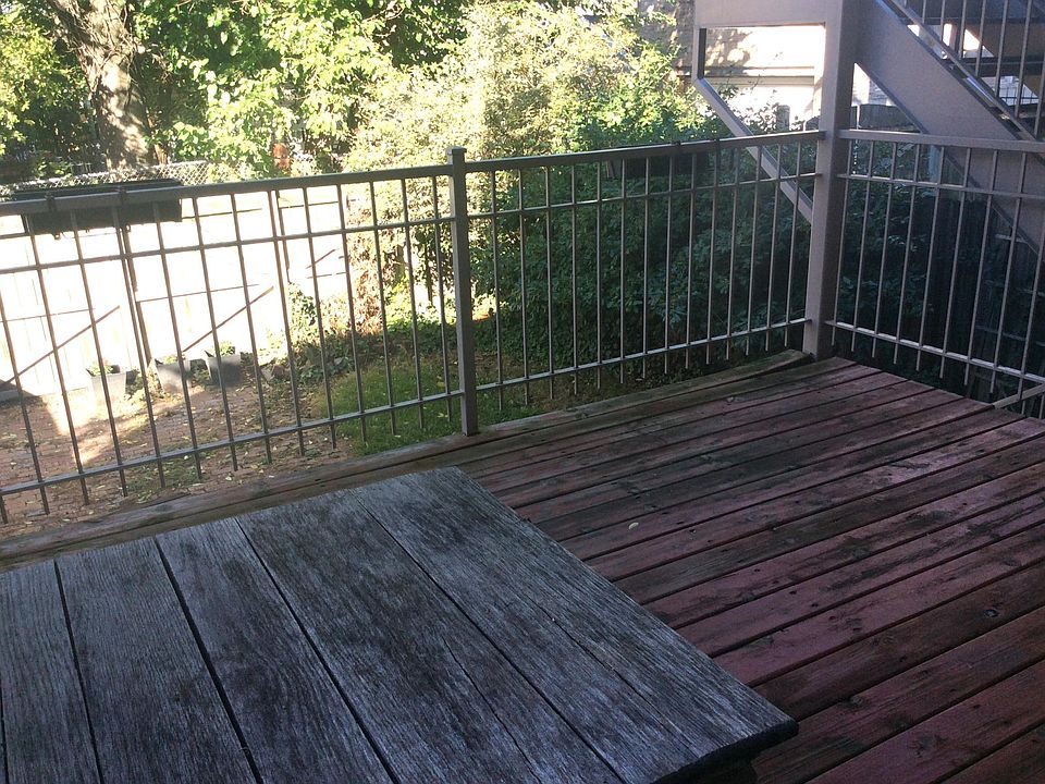 Private deck looks out onto grass & garden.