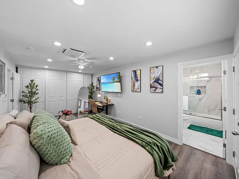A comfortable bedroom with a soft bed, fresh linens, and plenty of space to relax.