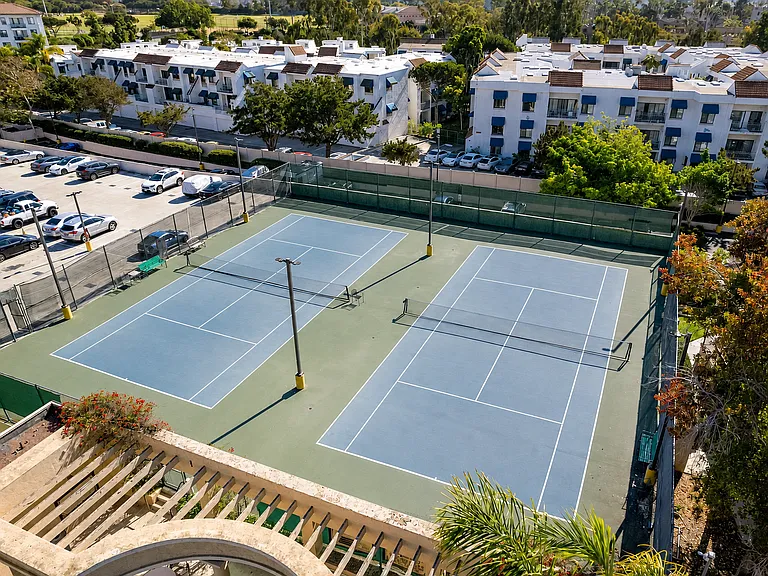 Tennis courts + parking garage located very close to the unit