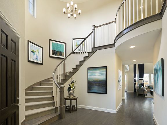 Breathtaking spiral staircase greets you at the foyer formerly featured at Trinity Falls.