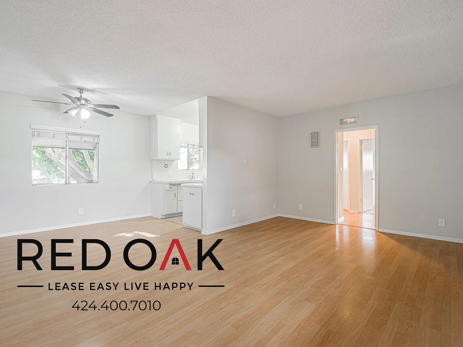 ~Spacious 2-Bed/1.5-Bath with Parking Included, Beautiful Hardwood Floors, and On-Site Laundry in... — Photo 1
