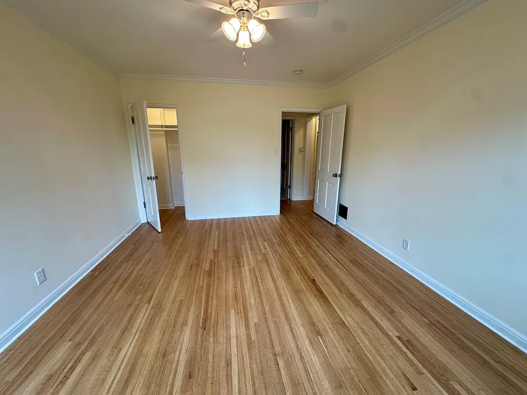 Bedroom, looking toward the closet, and the doorway, into hallway, across from the bathroom
