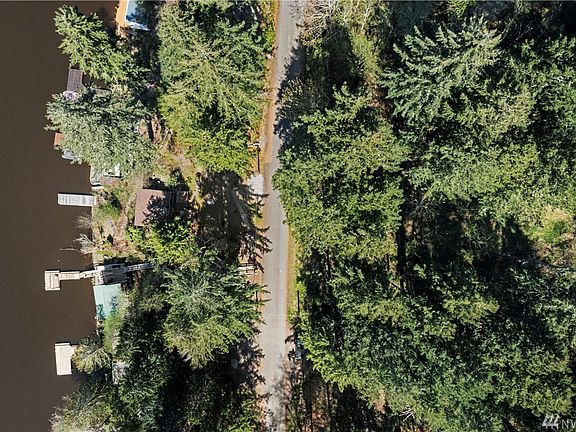 Just over an acre the property offers 56 feet of low bank lake front. Property also runs on the other side of Ski Park Road . Possibilities for additional parking or building........
