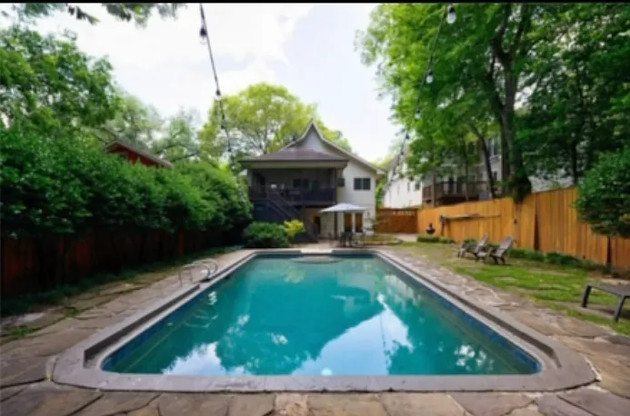 big pool for lap swimming, 10 feet deep. Note unit A includes screened in back porch with view of back yard and pool