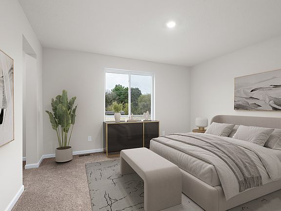 The master bedroom has enough space to fit a large bed and two side tables.