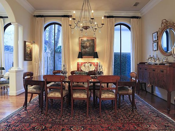 FORMAL DINING (16x13) The openess of the arched entry from the formal living room and view of the curved staircase creates a beautiful setting while entertaining guests.