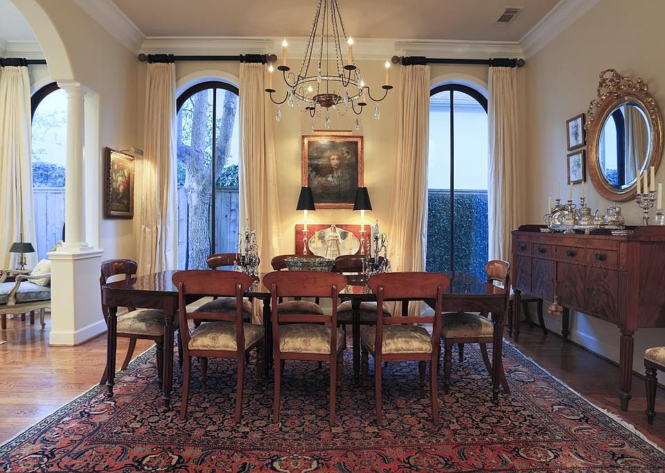 FORMAL DINING (16x13) The openess of the arched entry from the formal living room and view of the curved staircase creates a beautiful setting while entertaining guests.