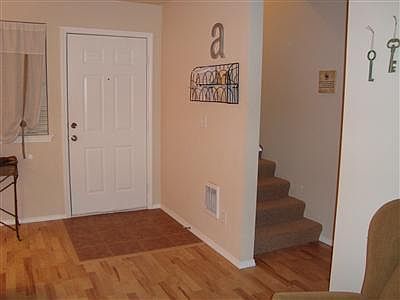 Quality laminate floors in the living areas for high durability and low maintenance. This is the entry to one of the units. All units are identical or mirror image of each other.