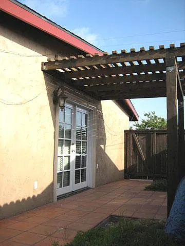 Side Yard w/ French Door Access to Living Room