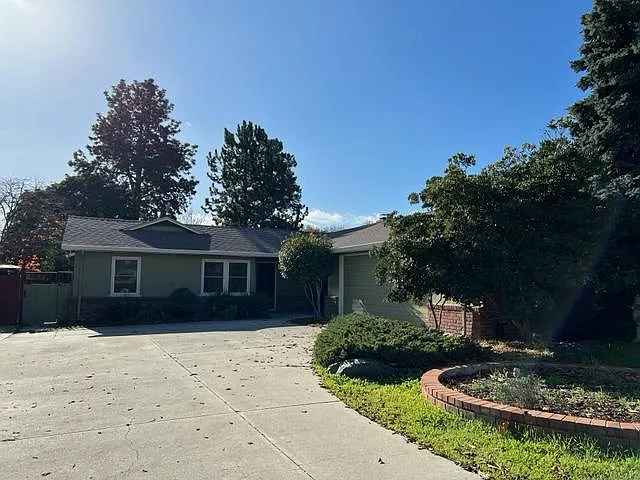 Two car garage with a lot of storage and driveway for up to 5 cars