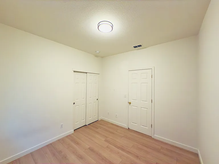 Room 2: A charming and intimate space, perfect as a cozy bedroom. Natural light enhances the room, making it a comfortable and inviting retreat.