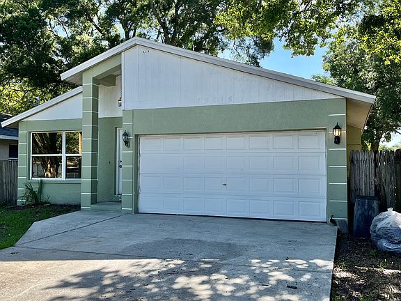 Large driveway with 2 car garages