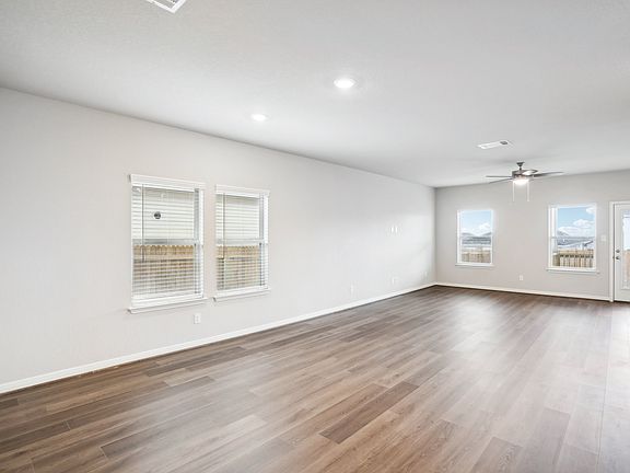 Dining room and living room of the Reynolds floorplan at a Meritage Homes community.