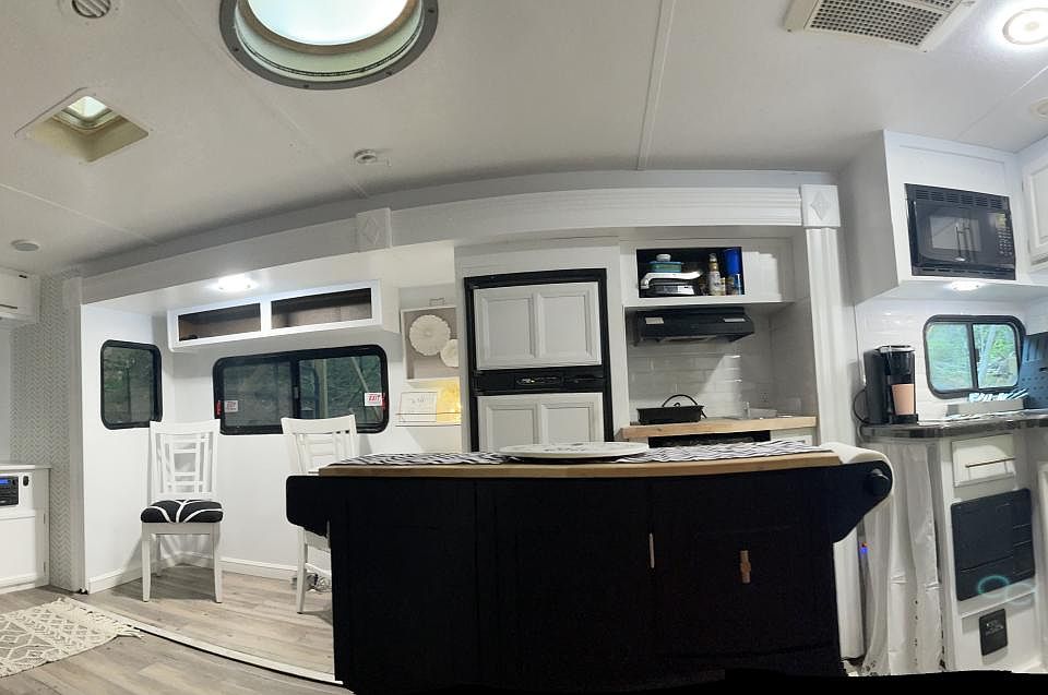 open living kitchen with island fireplace and tv