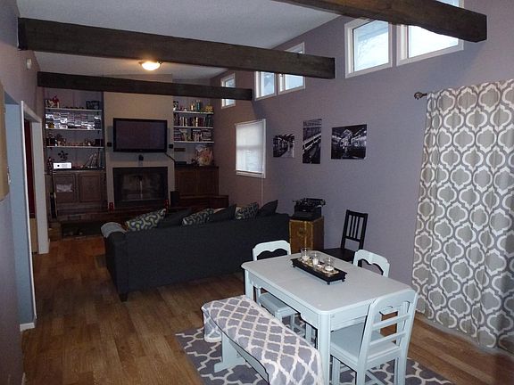2 Story living room and family room with new  floors and pai