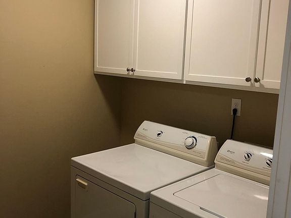 Separate utility room with great storage.