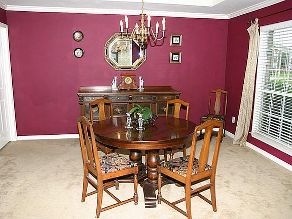 Formal Dining room with large window, crown molding