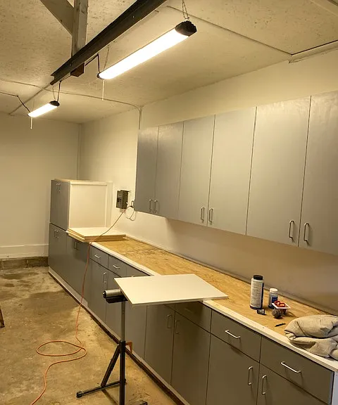 Over-sized Garage - added new cabinets and lighting