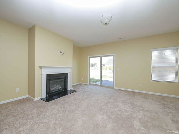 Handsome gas log fireplace in great room
