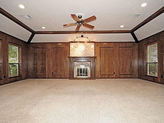 Large, inviting family room boasts of beautiful wood.