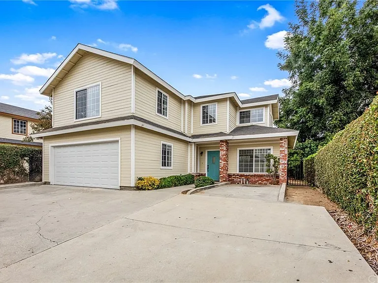 Back house with attached 2 car garage