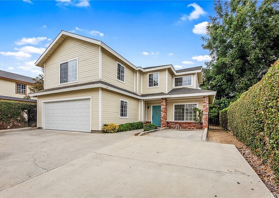 Back house with attached 2 car garage