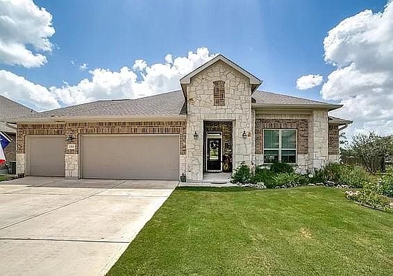 3 car garage. Landscaped yard with sprinkler system. 2,125 sq ft