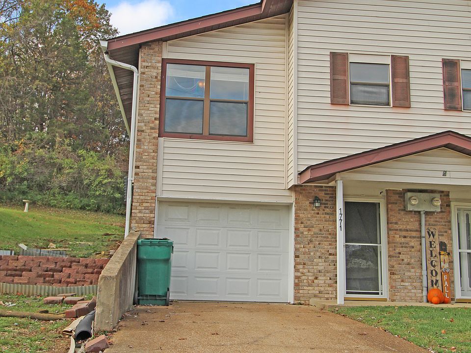 Outside of house with garage.